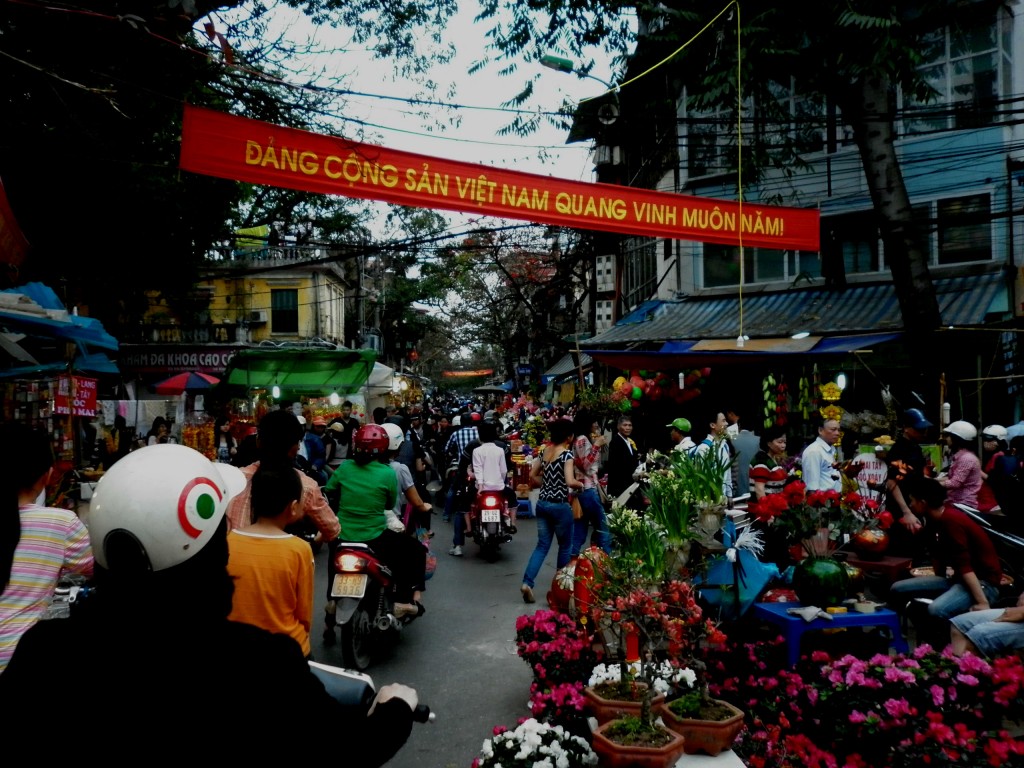 A busy Hanoi marketplace dedicated to providing all things related to Tet, or the Vietnamese New Year.  The banner above, roughly translated: The Communist Party of Vietnam Shining Forever!