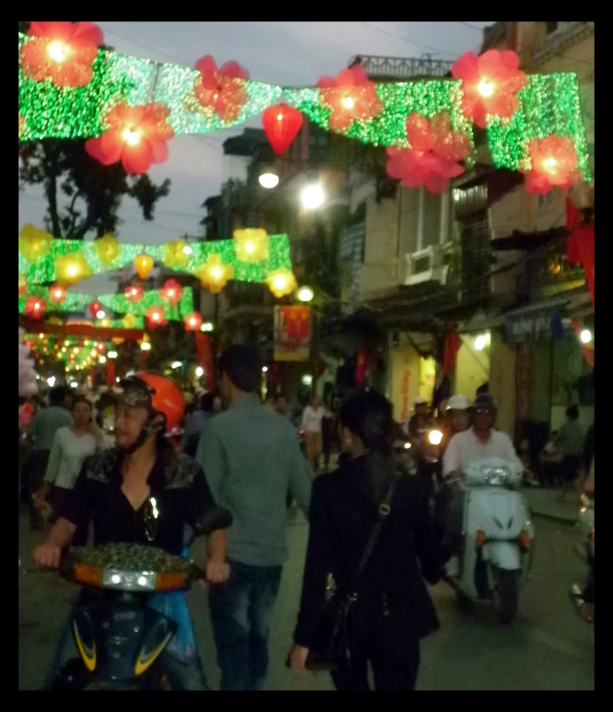 The city is all dressed up for Tet.  One of the main roads in Hanoi's Old Quarter.